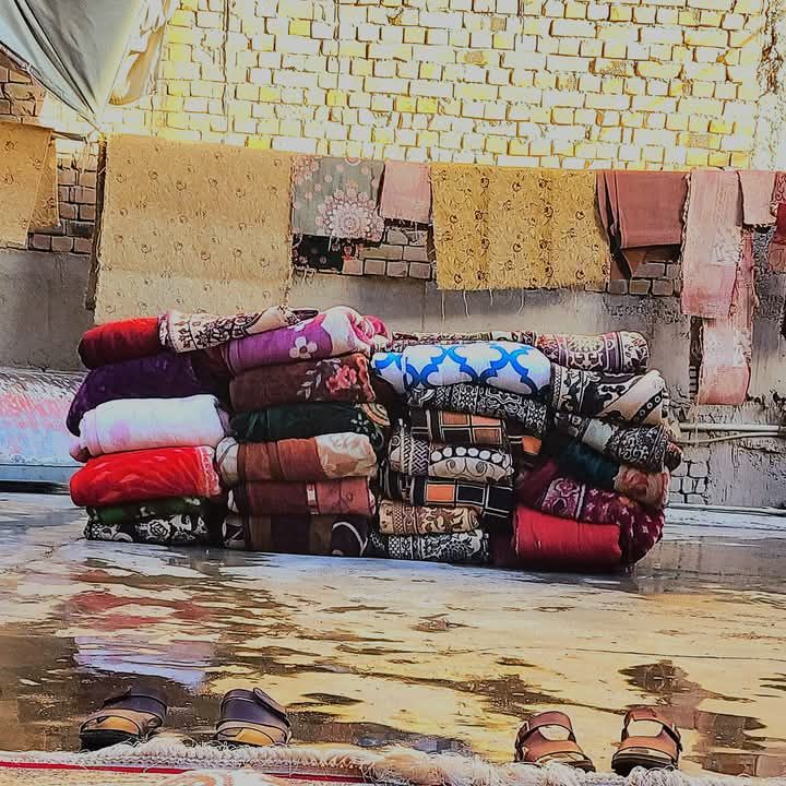 Stack of freshly washed carpets and rugs folded at Al-Safa factory