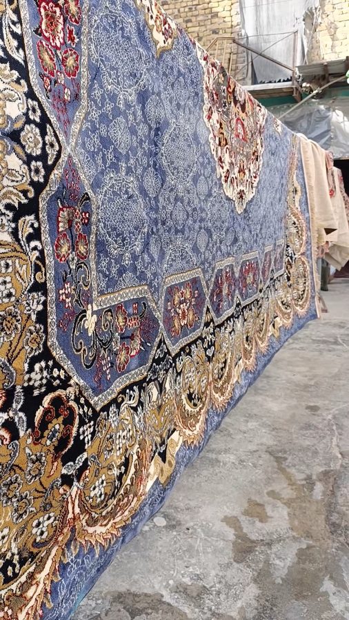 Fine handwoven qaleen laid out for washing at Al-Safa factory